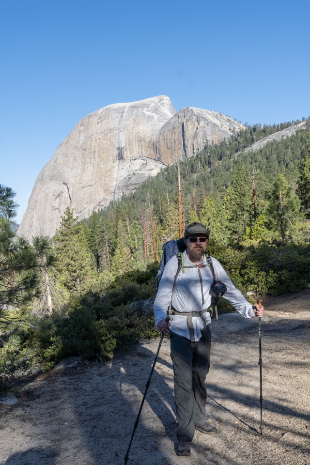 James posing with Half Dome in the background on the trail up to Half Dome. ©2021 David Rogers