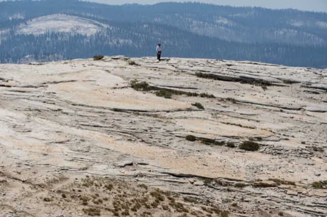 James on the far side of the top of Half Dome. ©2021 David Rogers