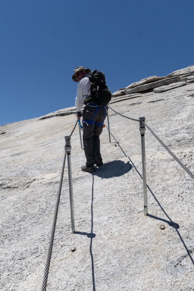 James descending the cables on Half Dome. ©2021 David Rogers