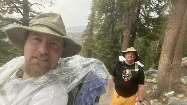 James and David climbing in the rain